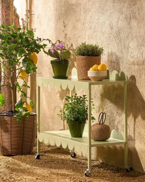 The Planttable Green by Mica Decorations isn’t just practical – it’s a true eye-catcher for any outdoor or indoor space. With its soft green tone, playful edge detail, and room for all your favorite herbs or